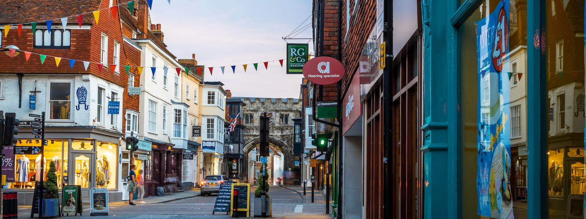 image of a town street in a town with shops on either side of the road