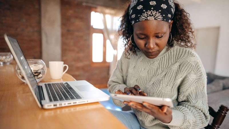 woman using laptop and tablet