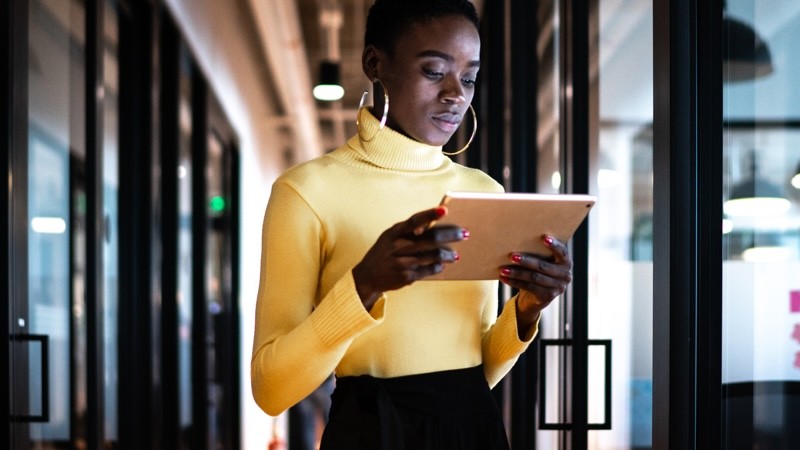 woman holding tablet