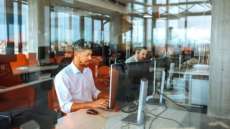 workers at computer desks